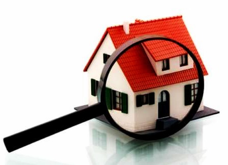 Home Inspection Paper Model House With a Magnifying Glass